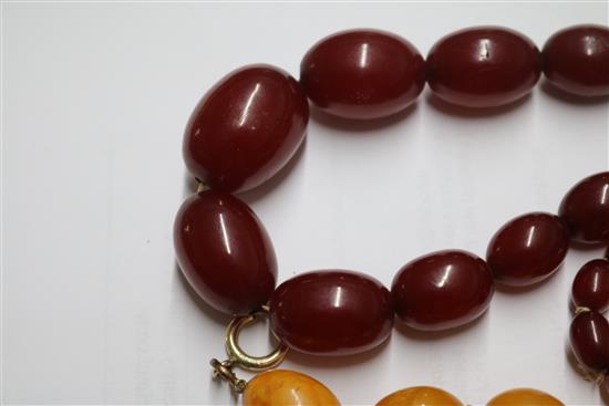 An amber bead necklace and a simulated cherry amber necklace.